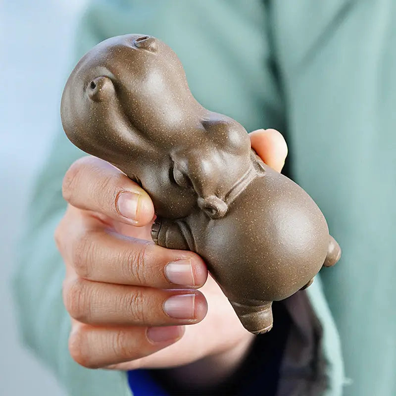 Brown ceramic hippopotamus figurine from Tranquil Hippo Yixing earth element tea pet