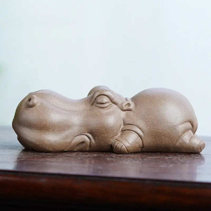 Sleeping hippopotamus figurine from Tranquil Hippo Yixing earth element tea pet