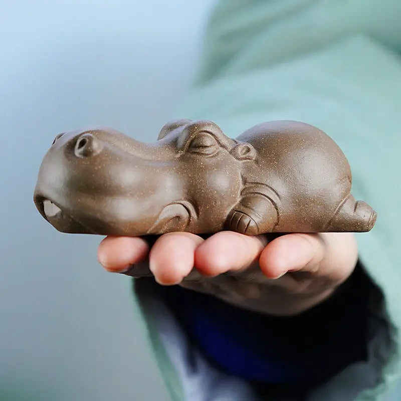 Brown ceramic hippo figurine from Tranquil Hippo Yixing as an earth element tea pet