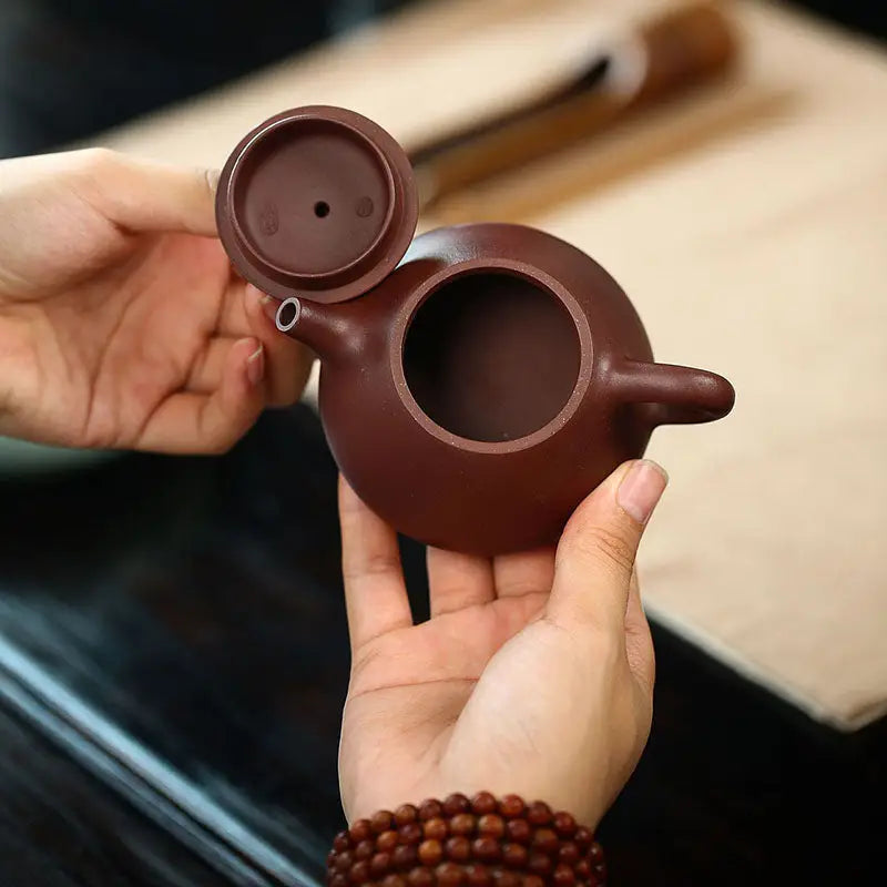 Brown Yixing Zisha teapot with lid from Tranquil Loop, ideal for gongfu tea rituals