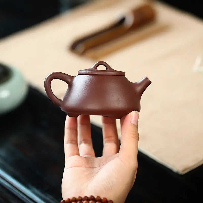 Small brown Yixing Zisha teapot from Tranquil Loop for Gongfu Tea Rituals in purple clay