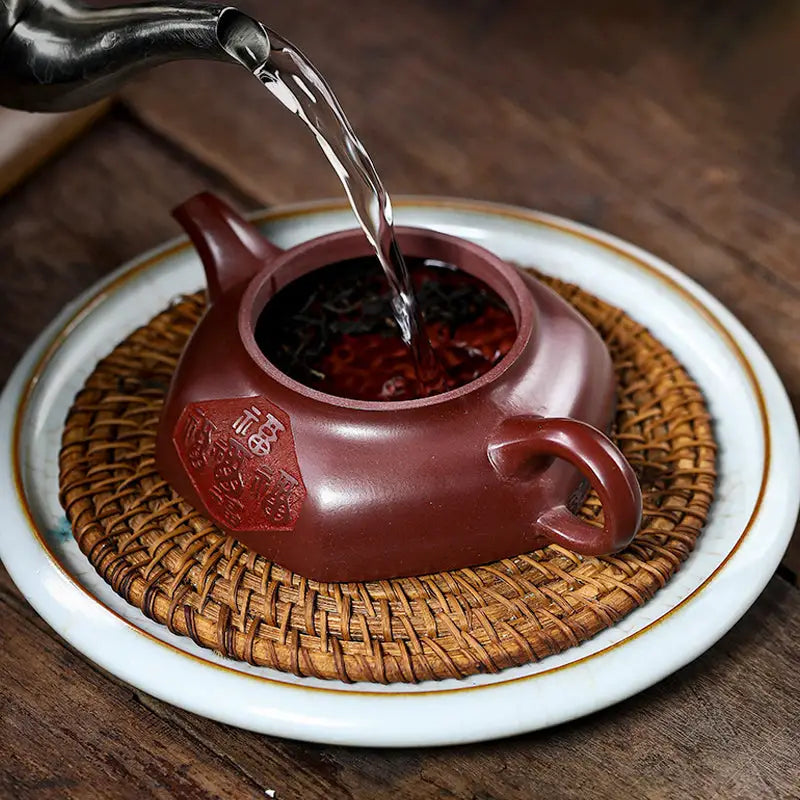 Maroon Treasure Blessing Yixing Zisha Teapot with five gourds being filled