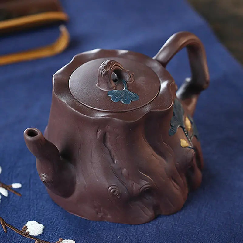 Brown tree stump teapot with bark texture and ginkgo leaves Yixing Zisha craftsmanship