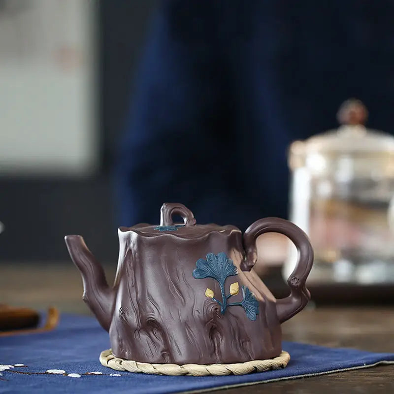 Brown tree trunk-shaped teapot with bark texture inspired by Ginkgo Leaves Yixing Zisha craftsmanship