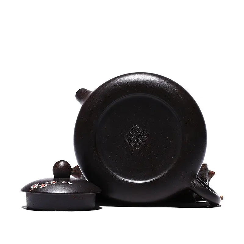 Dark brown Twilight Plum Yixing teapot with hand-painted plum blossoms on black Zisha clay