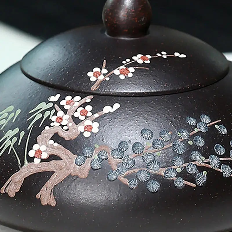 Dark brown Twilight Plum Yixing teapot with hand-painted plum blossoms on black Zisha clay