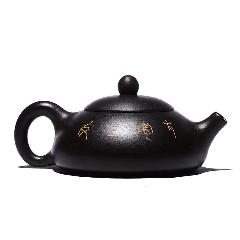 Dark brown Twilight Plum Yixing teapot with gold markings and hand-painted plum blossoms