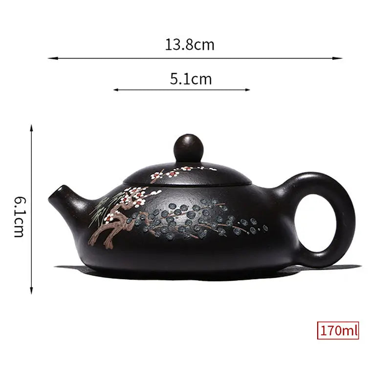 Black ceramic Twilight Plum Yixing teapot with hand-painted plum blossoms in black Zisha clay