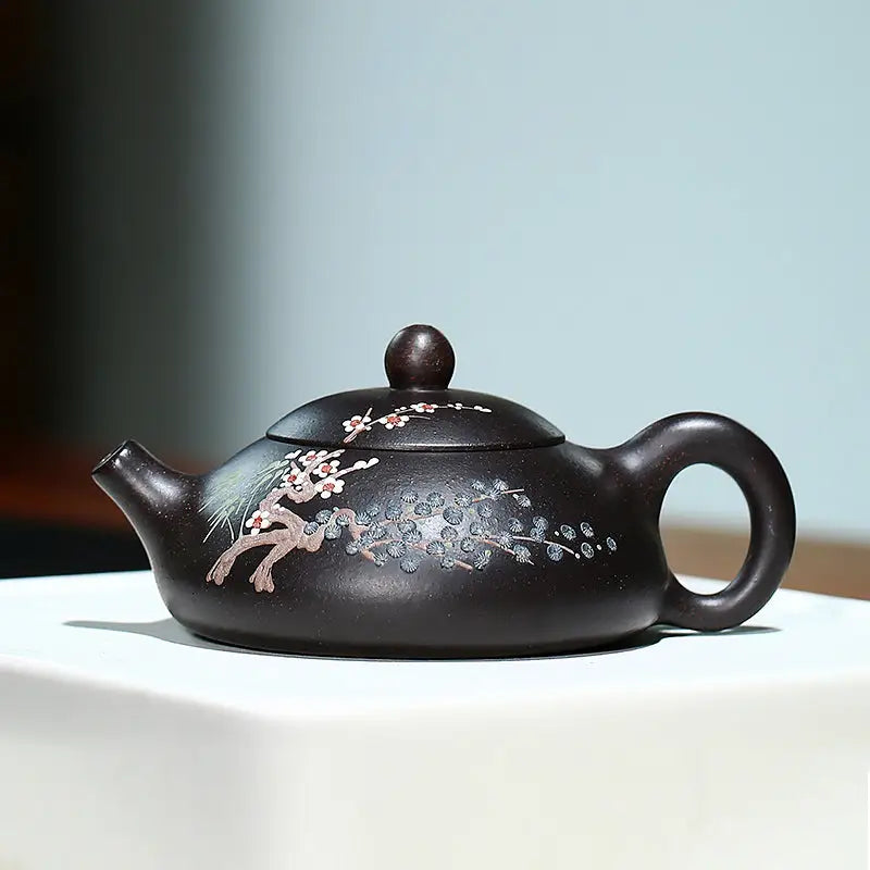 Dark brown Twilight Plum Yixing teapot with hand-painted plum blossoms in black Zisha clay