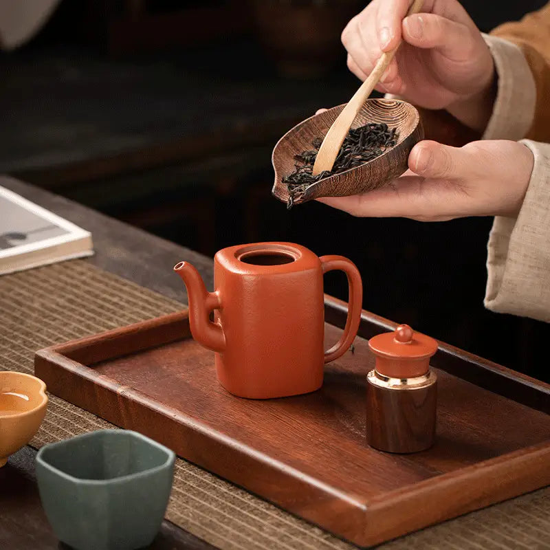 Square orange ceramic teapot from Verdant Echo Yixing Zisha Tea Set