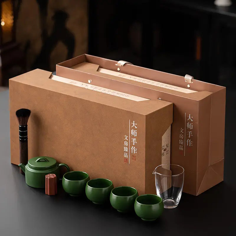 Verdant Voyage teaware set with clay teapot and green tea in brown packaging
