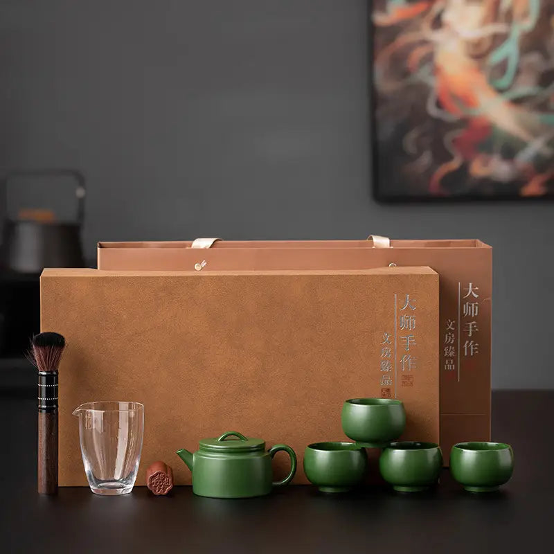 Verdant Voyage teaware set with green boxes and clay teapot for tea enthusiasts