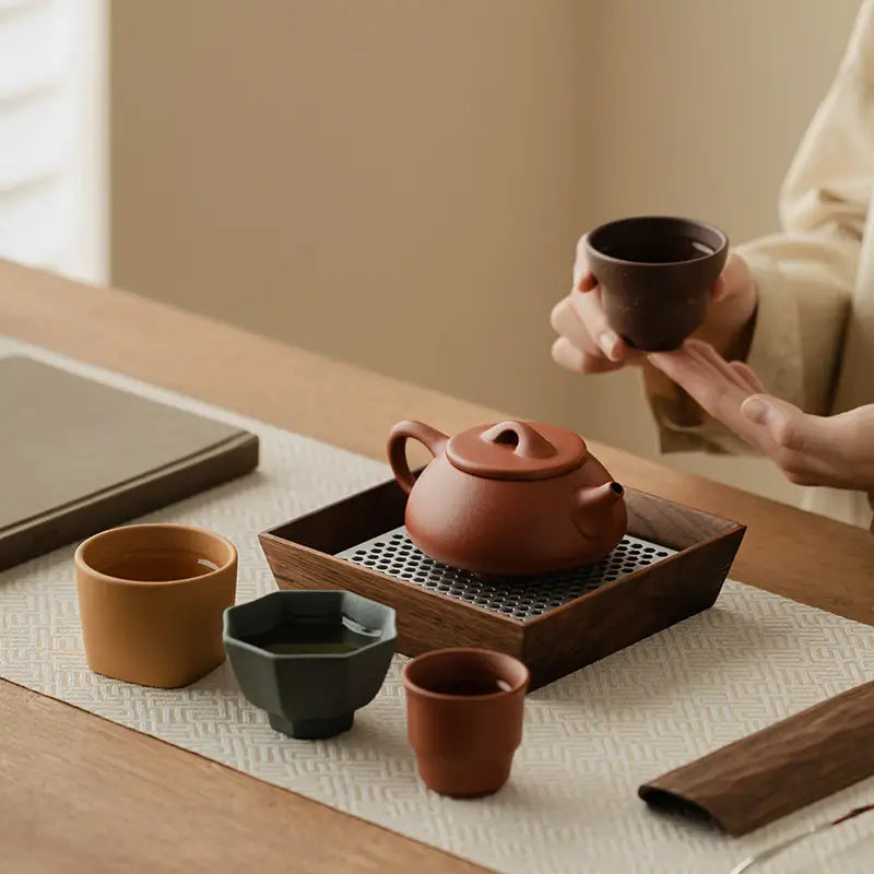 Earthenware Tea Set from Voices of Clay featuring Yixing Zisha Zisha Tea craftsmanship