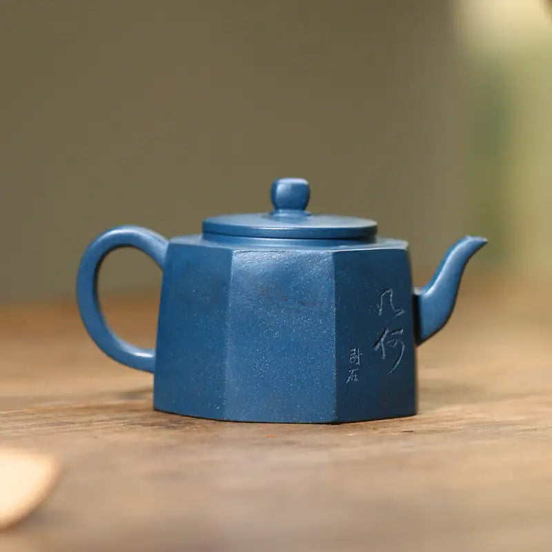 Octagonal blue Yixing teapot from the Waves of Mindfulness collection showcasing modern minimalism