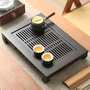 Dark wooden Whispering Bamboo tea tray with cups and pot for gongfu tea brewing