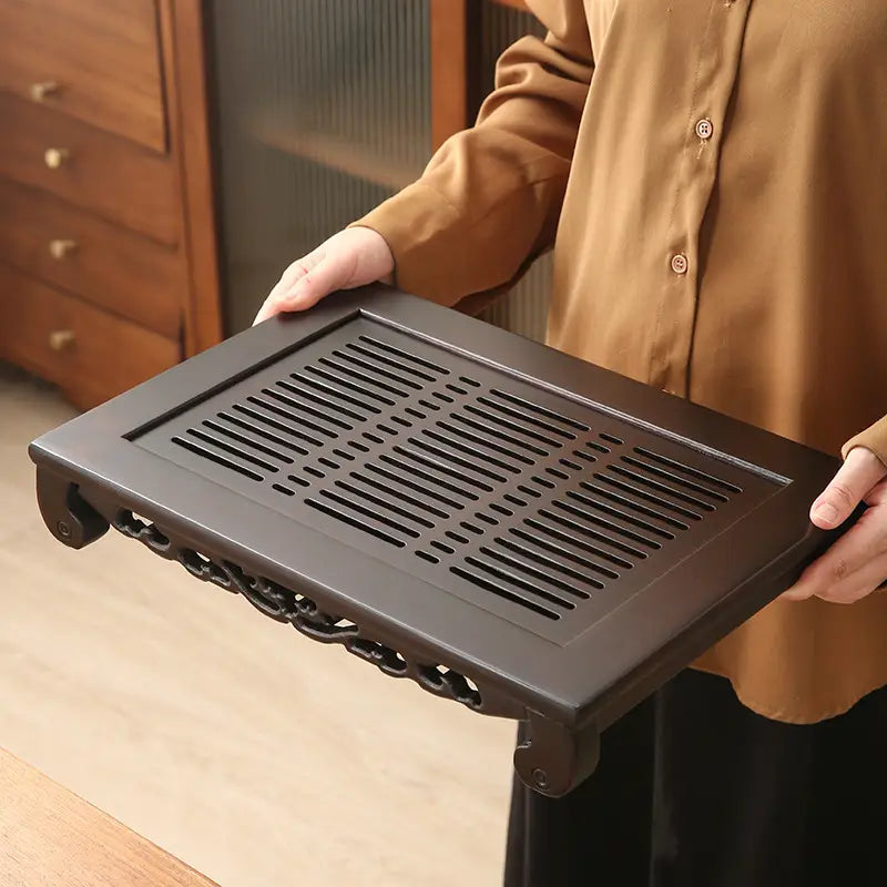 Dark brown wooden tea tray from Whispering Bamboo for authentic Gongfu Tea brewing