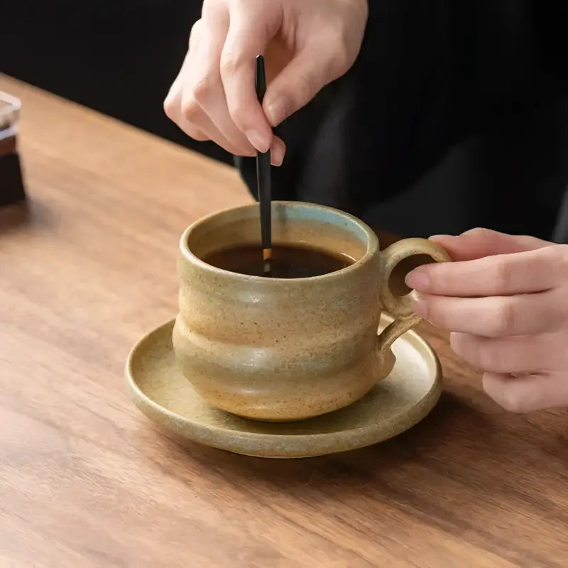 Hand-stirred ceramic coffee cup from Whispering Earth Coffee Cup collection