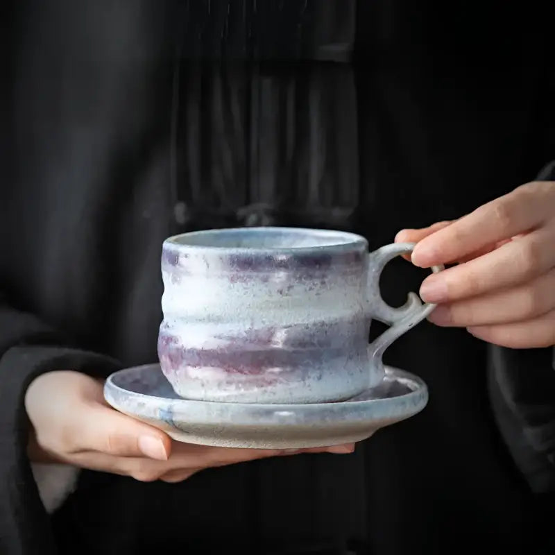 Handcrafted Whispering Earth ceramic coffee cup and saucer for stylish tea drinking
