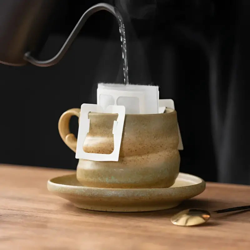 Pour-over coffee brewing in Whispering Earth ceramic coffee cup for a rich coffee experience