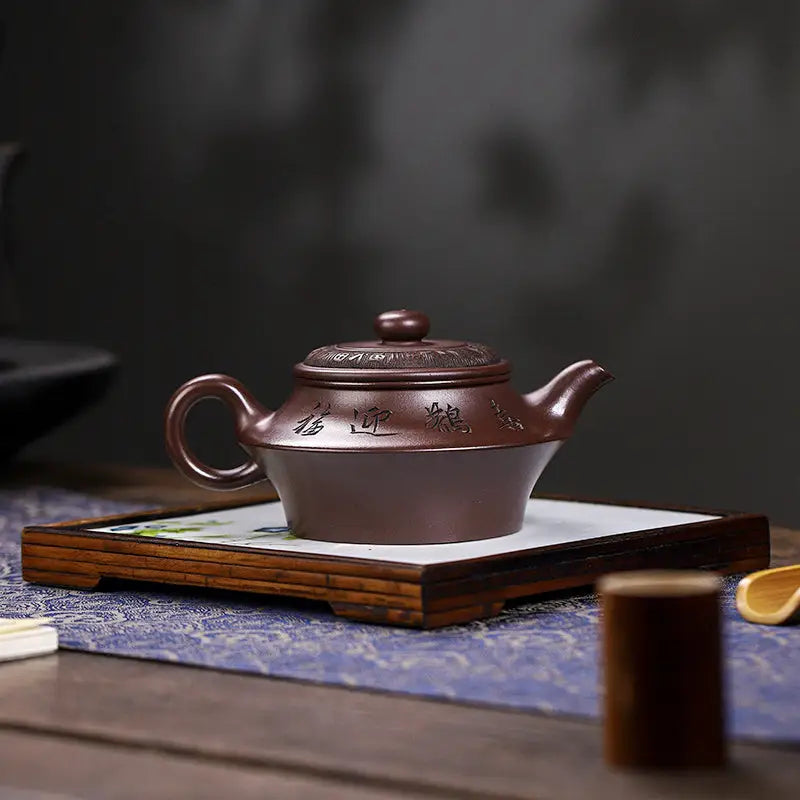 Brown ceramic teapot from Whispering Quail featuring Yixing Zisha craftsmanship