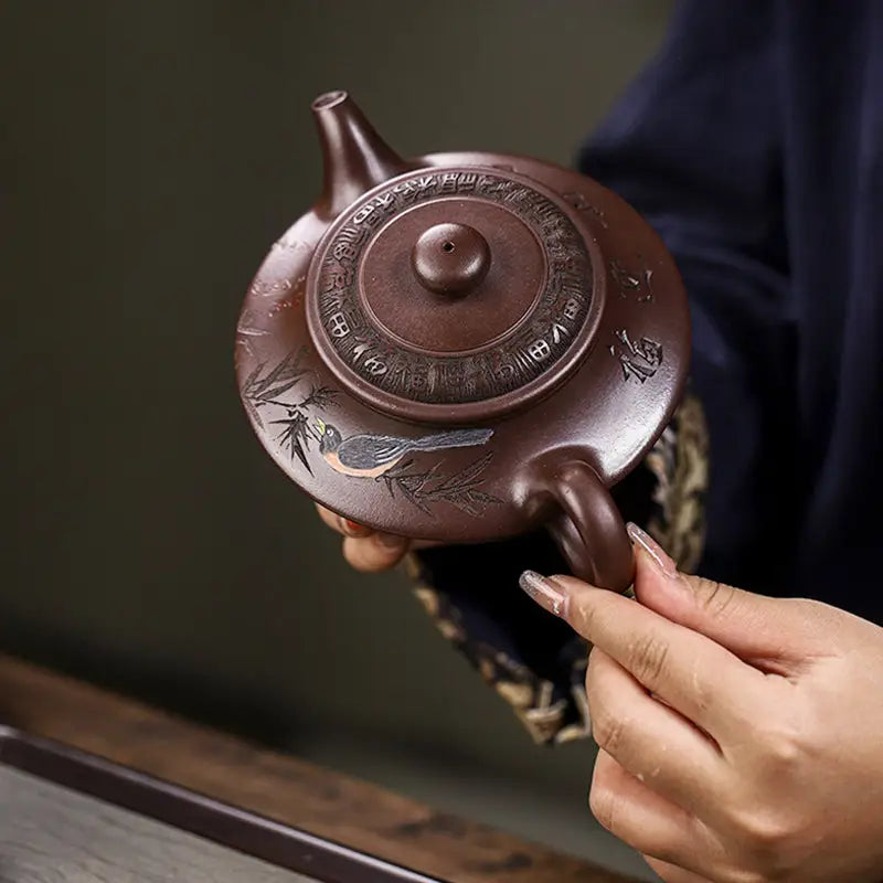 Brown Yixing Zisha teapot with bird and bamboo design from Whispering Quail