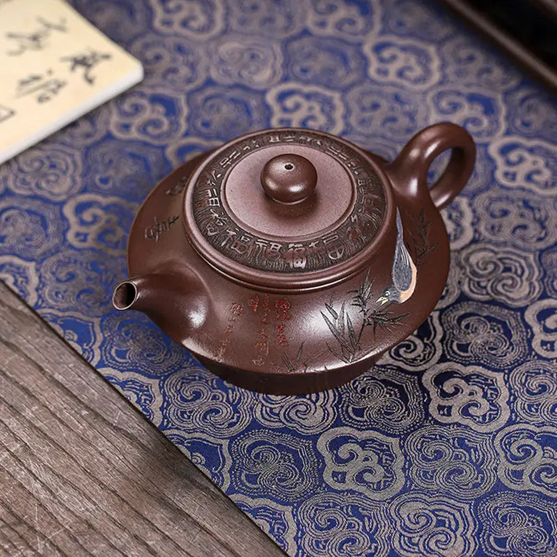 Brown ceramic whispering quail Yixing Zisha teapot with lid for elegant tea brewing
