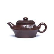 Brown ceramic Yixing Zisha teapot with bird design from Whispering Quail collection