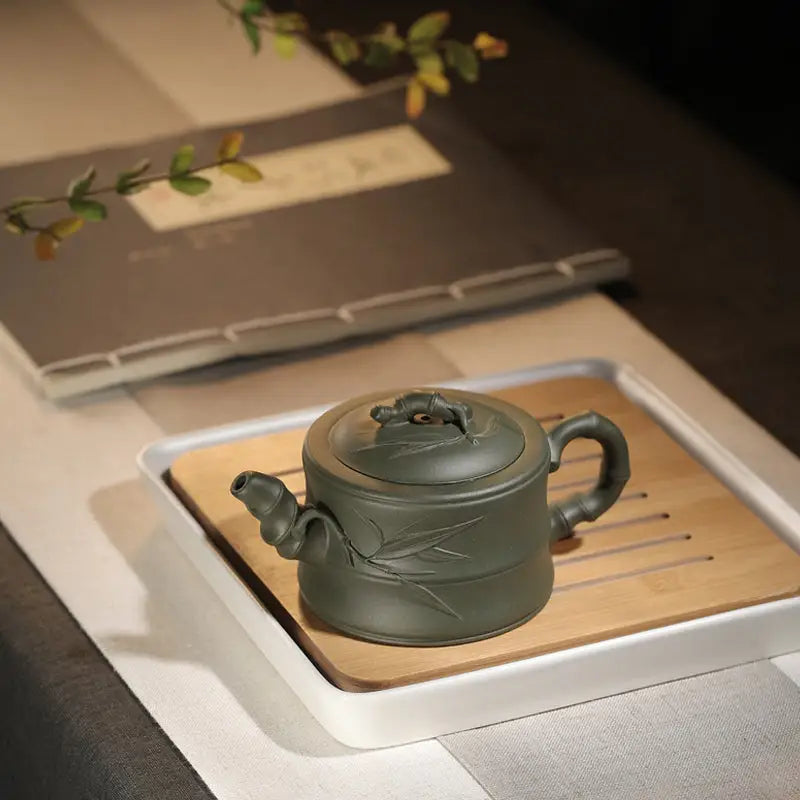 Green ceramic teapot from Whispers of Bamboo featuring a rare green duanni yixing zisha teapot