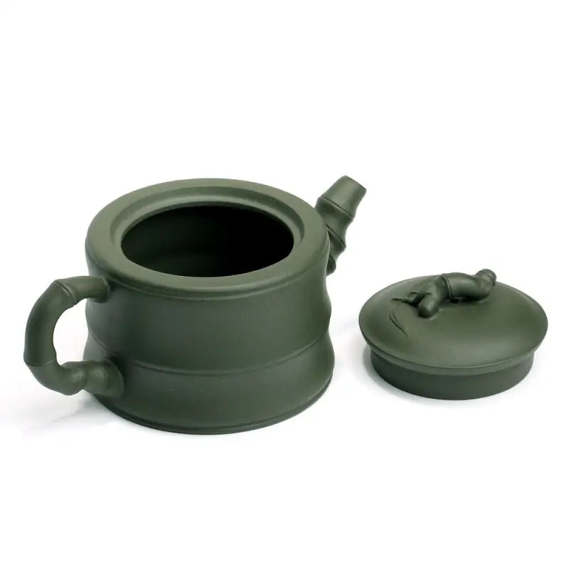 Green ceramic teapot with bamboo accents from Whispers of Bamboo, Yixing Zisha teapot