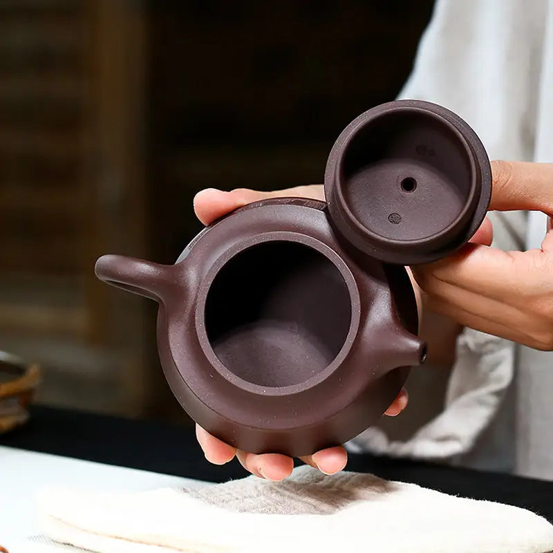 Brown ceramic Yixing Zisha teapot with lid from the Whispers of Stillness collection