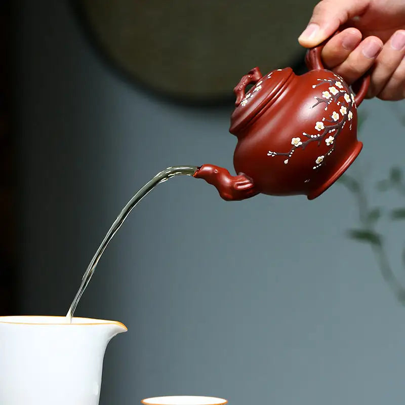 Red-brown Yixing teapot with hand-painted plum blossoms in authentic Zisha clay for Winter Bloom