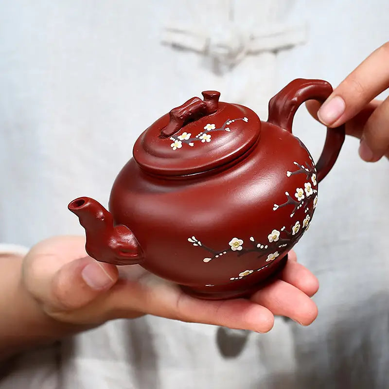 Reddish-brown Reddish-brown Yixing teapot with hand-painted plum blossoms in authentic Zisha clay