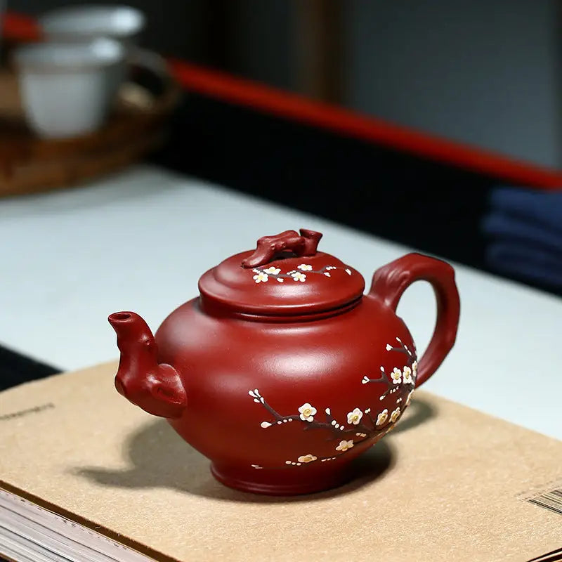 Reddish-brown Yixing teapot with hand-painted plum blossoms in authentic Zisha clay for Winter Bloom