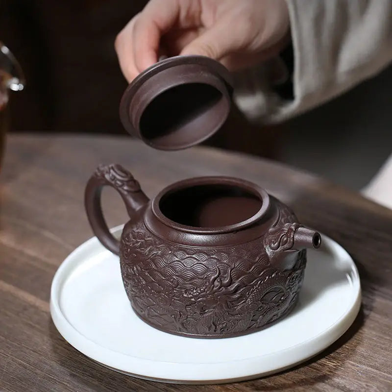 Wishful Dragon ornate brown Yixing Zisha teapot with lid, crafted from purple clay