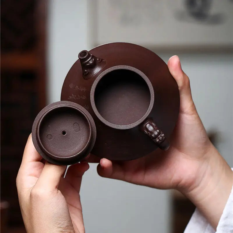 Open brown Yixing Zisha teapot with wishful dragon and dragon spout design