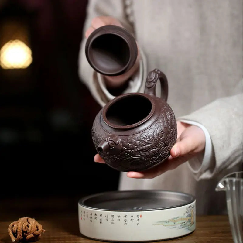 Wishful Dragon brown Yixing Zisha teapot with intricate dragon design on purple clay