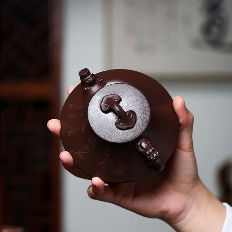 Round brown Yixing Zisha teapot with dragon spout and mushroom-shaped lid from Wishful Dragon