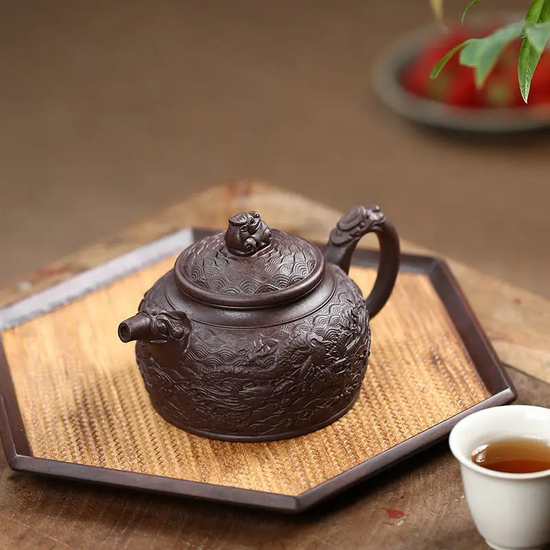 Ornate brown teapot from Wishful Dragon crafted with Yixing Zisha purple clay craftsmanship