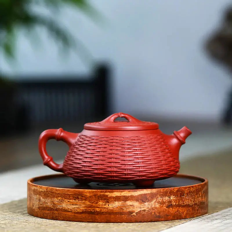 Red woven-textured Yixing Teapot from Woven Whispers showcasing Zisha clay craftsmanship