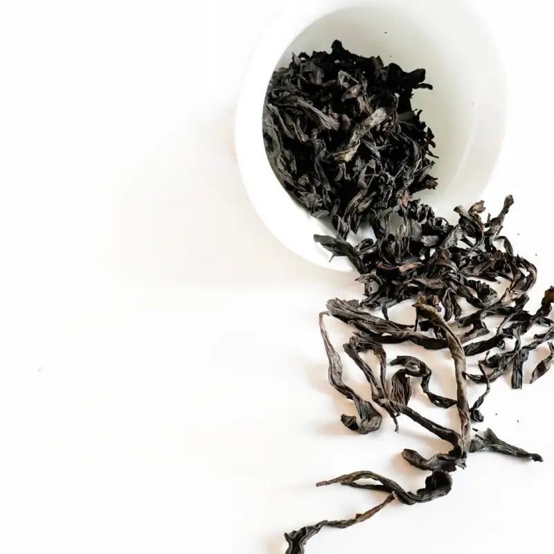 Loose dark Wuyi Rougui rock tea leaves from traditional roasting process