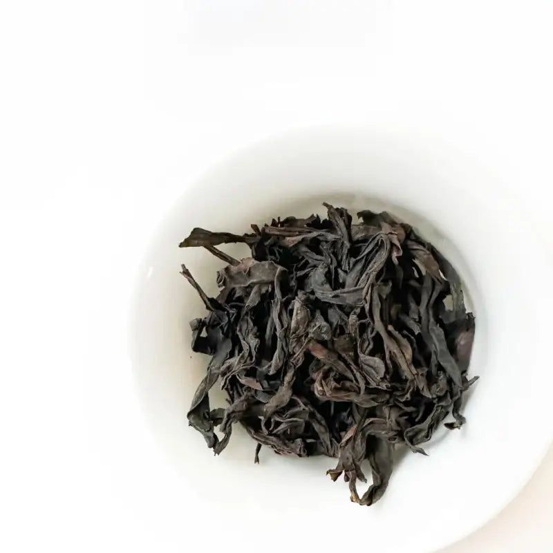 Dark, dried Wuyi Rougui tea leaves from traditional roasting for Rougui Rock Tea