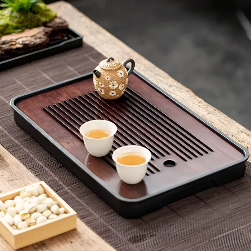 Tea set on wooden tray with Zen Flow Tea minimalist drainage for gongfu tea brewing