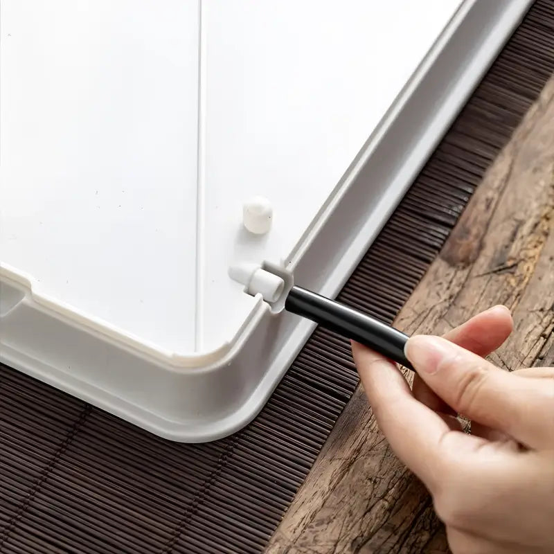 White plastic tray with black pen for Zen Flow Tea minimalist drainage and gongfu tea brewing
